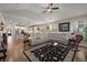 Bright living room featuring hardwood floors, a ceiling fan and a beige sectional sofa at 658 Yellow Leaf Ln, Summerville, SC 29486