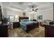 Spacious main bedroom with tray ceiling, fan, and ample natural light at 658 Yellow Leaf Ln, Summerville, SC 29486