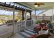 Relaxing screened porch with comfortable seating and a view of the landscaped backyard at 658 Yellow Leaf Ln, Summerville, SC 29486
