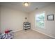 Cozy bedroom featuring carpeted floors, neutral walls, and a window providing natural light at 72 Crossandra Ave, Summerville, SC 29483