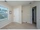 Neutral bedroom with carpeted floors and a window overlooking an exterior view at 72 Crossandra Ave, Summerville, SC 29483