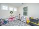 Versatile bonus room with ample natural light, neutral walls, and a patterned gray rug at 72 Crossandra Ave, Summerville, SC 29483
