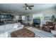Open-concept living area with hardwood floors, comfortable seating, and seamless flow to kitchen at 72 Crossandra Ave, Summerville, SC 29483