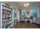 Cozy office with abundant natural light, built-in bookshelves, and a comfortable seating area at 72 Crossandra Ave, Summerville, SC 29483