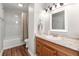 Bathroom features a vanity with drawers and a tub and shower with white tile surround at 7814 Nummie Ct, North Charleston, SC 29418