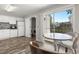 Bright kitchen featuring modern appliances, wood-look floors and sliding glass doors to the patio at 7814 Nummie Ct, North Charleston, SC 29418