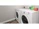 Bright laundry area featuring modern, white, front-load washer and dryer at 7814 Nummie Ct, North Charleston, SC 29418