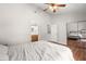 Spacious main bedroom with wood floors, ceiling fan, closet, and attached bath at 7814 Nummie Ct, North Charleston, SC 29418