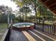 Elevated view of above ground pool with deck featuring beautiful wooded surroundings and natural light at 8334 Witsell St, North Charleston, SC 29406