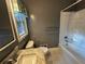 Bathroom featuring tiled floors, a shower-tub combo and a marble countertop at 8334 Witsell St, North Charleston, SC 29406