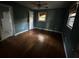 Bedroom featuring hardwood floors, window and an ensuite bathroom at 8334 Witsell St, North Charleston, SC 29406