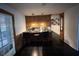 Eat in kitchen with peninsula seating and access to back yard at 8334 Witsell St, North Charleston, SC 29406