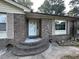 Close-up of the front door, showcasing the brick steps and architectural details at 8334 Witsell St, North Charleston, SC 29406