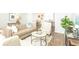 Bright living room showcases neutral furniture, hardwood flooring, and comfortable seating at 8859 Shovelnose Ct, North Charleston, SC 29406