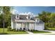 Charming single Gathering home with lap siding, dormer windows, covered entry, and attached two car garage at 93 French Garden Cir, Summerville, SC 29486