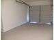 Spacious garage with freshly painted walls and sealed concrete floor ready for your vehicle at Way, Goose Creek, SC 29445