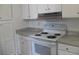 Kitchen with white appliances and cabinets with light countertops at Way, Goose Creek, SC 29445