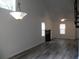 Bright living room boasts new flooring, soaring ceilings, and modern fireplace at Way, Goose Creek, SC 29445