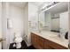 Well-lit bathroom features a double sink vanity, framed mirror, and hardwood flooring at 1005 Yellow Hawthorn Circle, Summerville, SC 29483