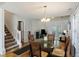 Dining room features a glass table, seating for four and hardwood floors at 1005 Yellow Hawthorn Circle, Summerville, SC 29483