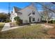 Charming townhome with light yellow siding, manicured landscaping, and inviting entryway at 1005 Yellow Hawthorn Circle, Summerville, SC 29483