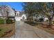 Inviting two-story home with a well-maintained lawn, garage, and a tree at 1005 Yellow Hawthorn Circle, Summerville, SC 29483