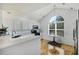 Bright kitchen with modern appliances, white cabinets, and large arched window at 1005 Yellow Hawthorn Circle, Summerville, SC 29483