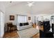 Bright living room with hardwood floors and vaulted ceilings open to dining area at 1005 Yellow Hawthorn Circle, Summerville, SC 29483