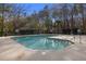 Community swimming pool surrounded by mature trees and an iron fence. No diving allowed at 1005 Yellow Hawthorn Circle, Summerville, SC 29483