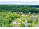 Aerial perspective of a tree-lined neighborhood featuring homes with mature landscaping at 104 Study Ct, Ladson, SC 29456
