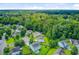 Aerial view of a suburban neighborhood nestled amongst lush trees and greenery, offering a tranquil environment at 104 Study Ct, Ladson, SC 29456