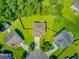 Aerial shot of home with a large, manicured lawn with mature trees and backyard patio at 104 Study Ct, Ladson, SC 29456