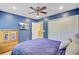 Bedroom features a ceiling fan, closet with sliding doors and mounted TV at 104 Study Ct, Ladson, SC 29456