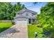 Charming two-story home boasts a well-manicured lawn, attached two-car garage, and a welcoming front porch at 104 Study Ct, Ladson, SC 29456