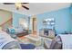 Bright living room featuring a ceiling fan, modern furnishings, and light blue walls at 104 Study Ct, Ladson, SC 29456