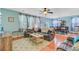 Inviting living room with a ceiling fan, hardwood floors, and an adjacent dining area at 104 Study Ct, Ladson, SC 29456