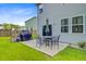 The patio features a grill and patio table surrounded by chairs at 104 Study Ct, Ladson, SC 29456