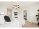 Cozy bedroom with ceiling fan, neutral tones, and view into the living room at 105 Brockman Way, Goose Creek, SC 29445