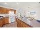 Kitchen with wood cabinets, stainless appliances, and breakfast area with a modern pendant light at 105 Brockman Way, Goose Creek, SC 29445