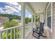 Relax on this balcony with rocking chairs and scenic neighborhood views at 109 Cypress Plantation Rd, Moncks Corner, SC 29461