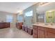 The bathroom offers dual sinks and vanities and lots of natural light at 109 Cypress Plantation Rd, Moncks Corner, SC 29461