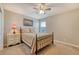 Charming bedroom with a queen-sized bed, vintage nightstand, and soft lighting, creating a cozy and inviting space at 109 Cypress Plantation Rd, Moncks Corner, SC 29461