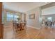 Bright dining room with wood floors, chandelier, and a view into the adjacent kitchen at 109 Cypress Plantation Rd, Moncks Corner, SC 29461