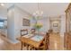 Charming dining area with wood floors, classic lighting, and open floor plan at 109 Cypress Plantation Rd, Moncks Corner, SC 29461