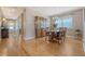 Open dining room with wood floors, china cabinet, and natural light from the window at 109 Cypress Plantation Rd, Moncks Corner, SC 29461