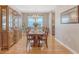 Spacious dining area featuring wood floors, natural light, and classic china cabinet at 109 Cypress Plantation Rd, Moncks Corner, SC 29461