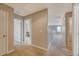 A bright hallway with neutral walls and carpet leads to various rooms in the home at 109 Cypress Plantation Rd, Moncks Corner, SC 29461