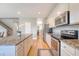Bright kitchen with stainless steel appliances and granite countertops at 109 Cypress Plantation Rd, Moncks Corner, SC 29461