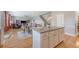 Kitchen island with granite countertops looking into living room area at 109 Cypress Plantation Rd, Moncks Corner, SC 29461