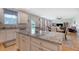Kitchen island with granite counters looking into dining and living areas at 109 Cypress Plantation Rd, Moncks Corner, SC 29461
